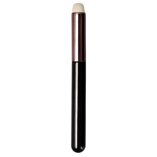 Black and white makeup brush on a white background