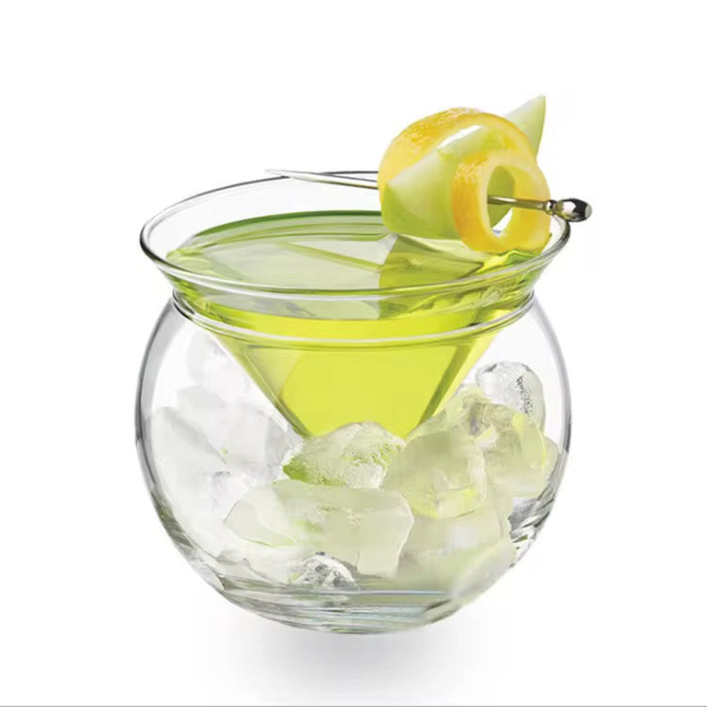 Glass of green cocktail with lemon twist and ice cubes on a white background