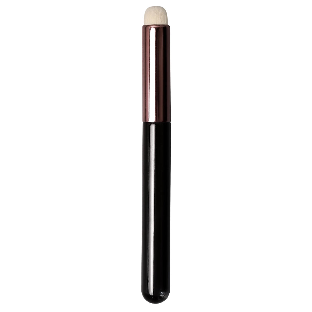 Black and white makeup brush on a white background