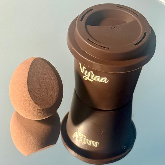 Brown travel mug with a matching round container on a light gray background