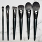 Set of makeup brushes on a marble surface